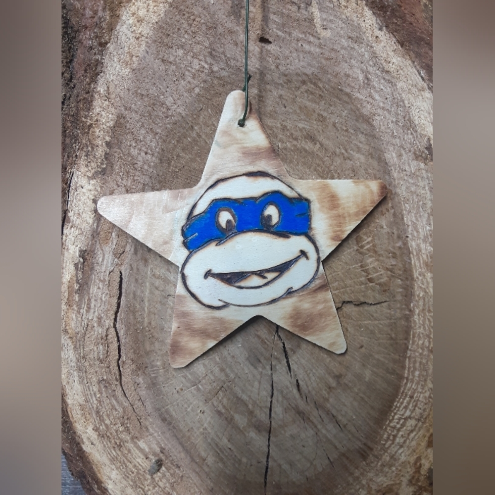 Woodburnt painted ornament